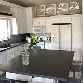 kitchen with vase and flowers.