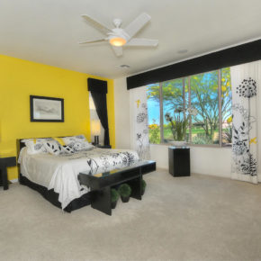 bed room with yellow wall.